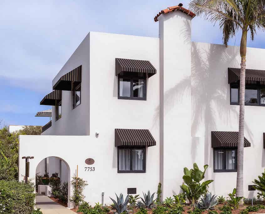 Orli La Jolla boutique hotel exterior with arched entrance and palm trees