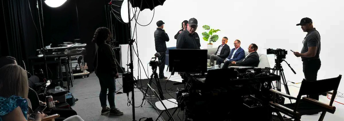 REV Studios team collaborating with a client on a branded video production project